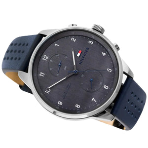 Left angled view of Tommy Hilfiger Chase 1791578 men's quartz battery watch showing blue leather strap and gunmetal case profile
