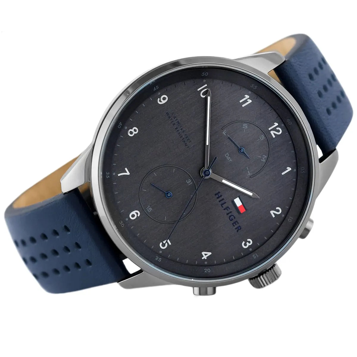 Left angled view of Tommy Hilfiger Chase 1791578 men's quartz battery watch showing blue leather strap and gunmetal case profile