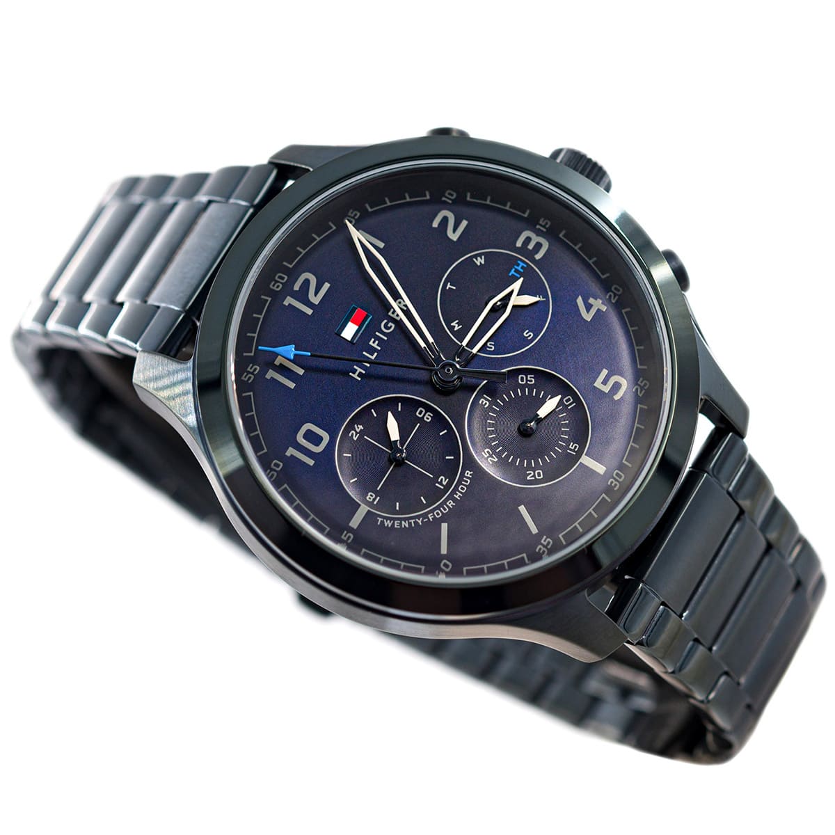 Left angled view of Tommy Hilfiger Asher 1791853 men's quartz battery watch showing blue stainless steel bracelet and case profile