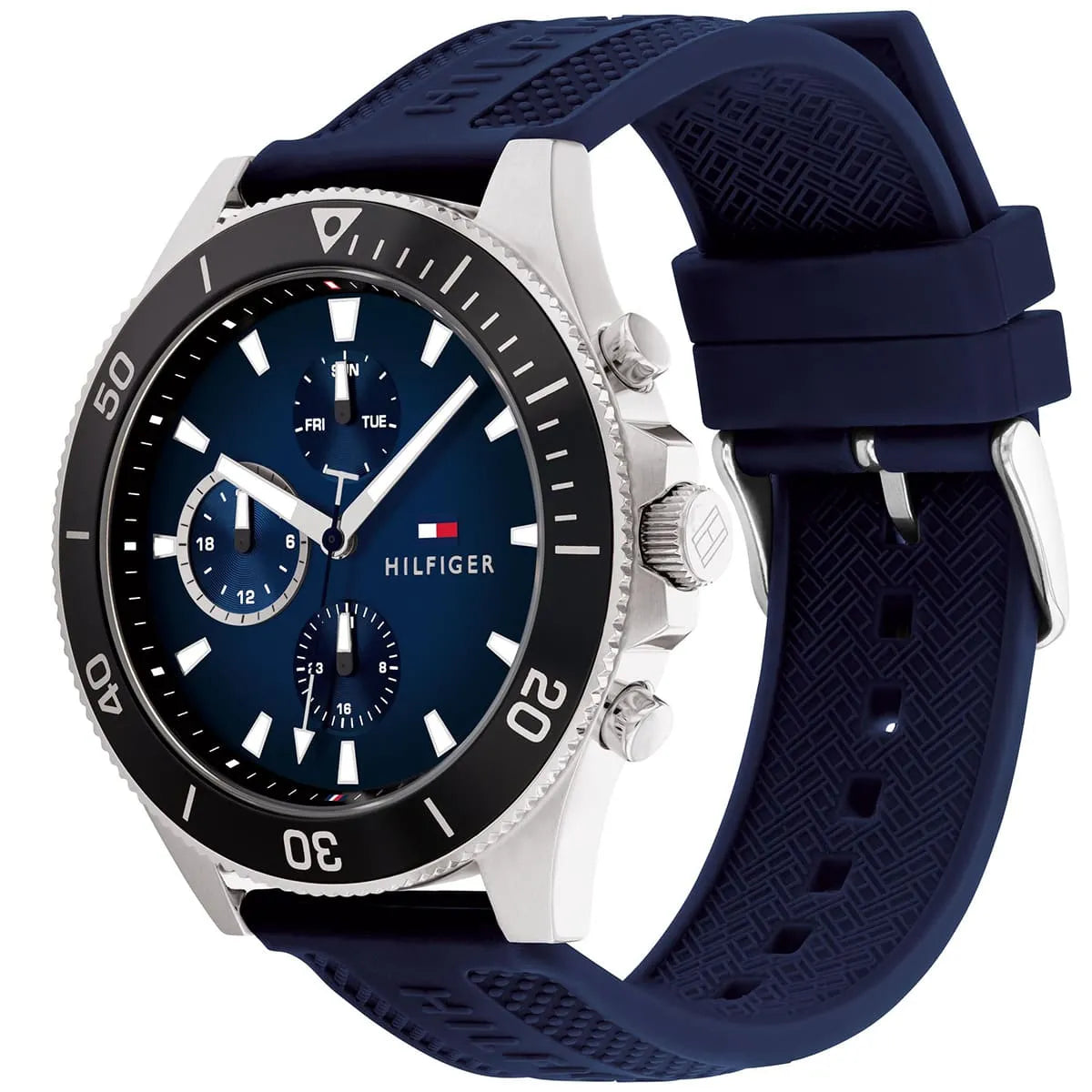 Angled real-life photo of Tommy Hilfiger 1791920 showing the silver case and blue rubber texture