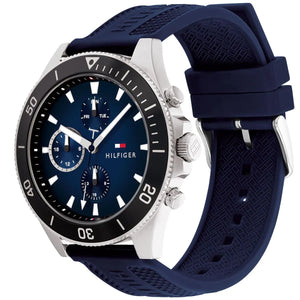 Angled real-life photo of Tommy Hilfiger 1791920 showing the silver case and blue rubber texture