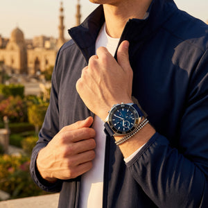 Lifestyle photo of Tommy Hilfiger 1791920 showing the watch on a man's wrist with sporty blue strap