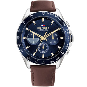 Tommy Hilfiger Damon 1791965 men's watch featuring a silver stainless steel case, textured blue multi-function dial, and brown leather strap