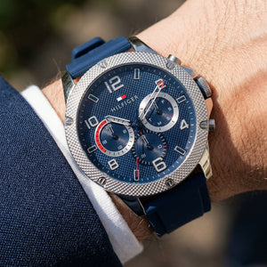 Close up shot of Tommy Hilfiger 1792027 on wrist showing blue dial and multi-function sub-dials
