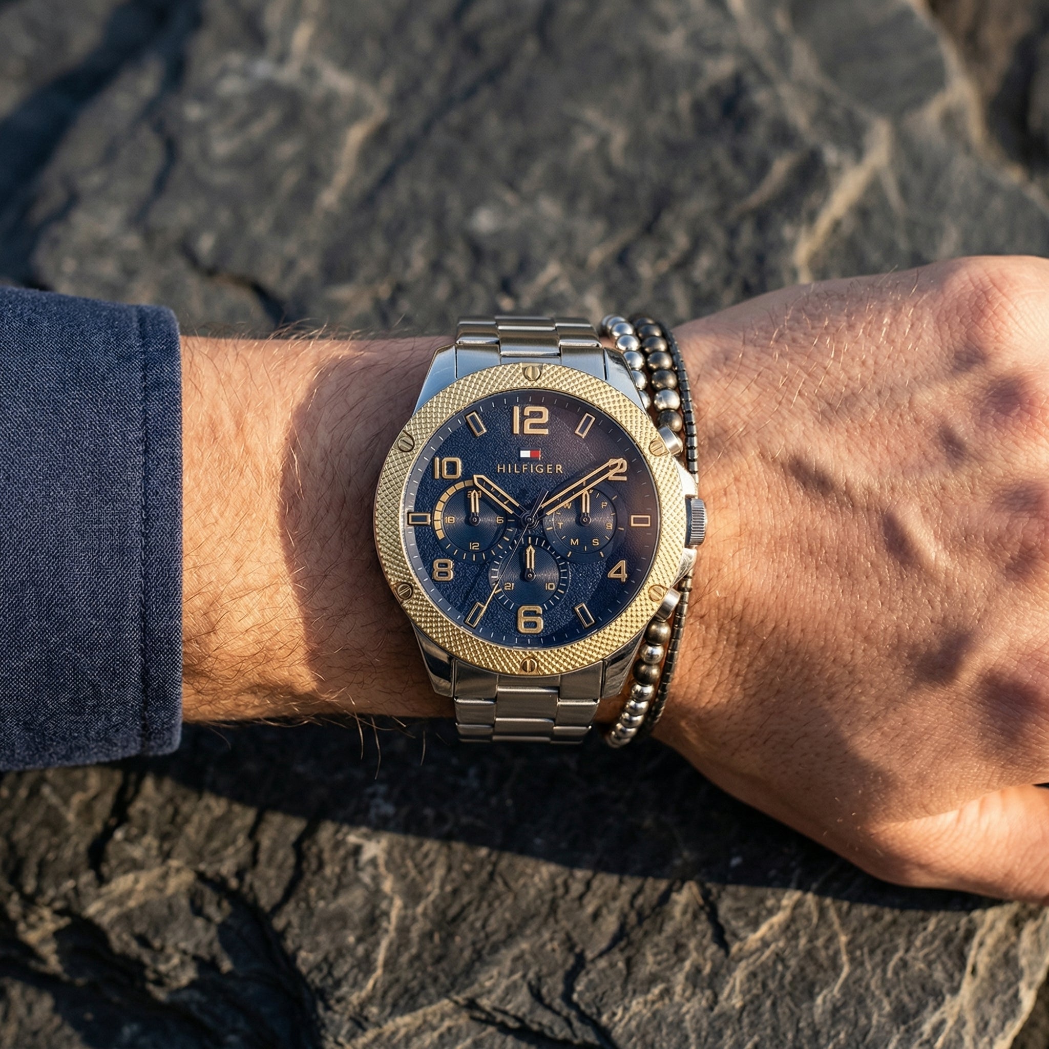 Close up shot of Tommy Hilfiger 1792031 on wrist showing blue dial and gold-tone sub-dial counters