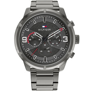 Tommy Hilfiger 1792071 men's watch featuring a gunmetal grey stainless steel case, multi-function textured dial with red accents, and metal bracelet