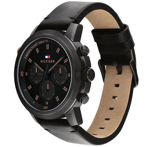 Angled real-life photo of Tommy Hilfiger 1792110 showing the black case and leather texture