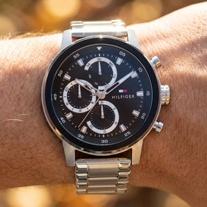 Close up shot of Tommy Hilfiger 1792181 on wrist showing the large silver case and multifunction dial