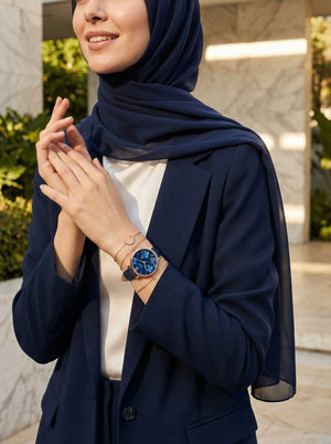 Lifestyle photo of Fossil Carlie Mini ES4673 showing the delicate rose gold watch on a woman's wrist