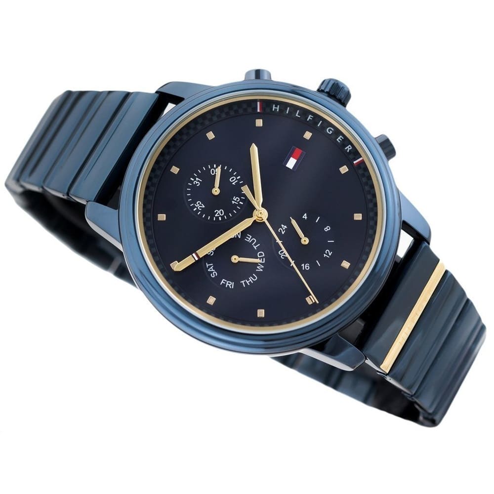 Angled real-life photo of Tommy Hilfiger 1781893 showing the polished navy case and gold ring