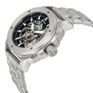 Silver Fossil watch with a detailed face on a white background