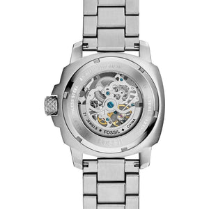 Silver Fossil watch with mechanical movement on a white background