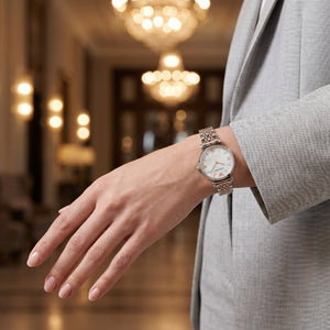 AR1987 Female model wearing Emporio Armani Gianni T-Bar two-tone watch for a glamorous luxury look
