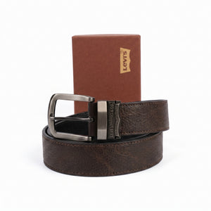 Brown leather belt with silver buckle in front of a Levi's branded box on a white background