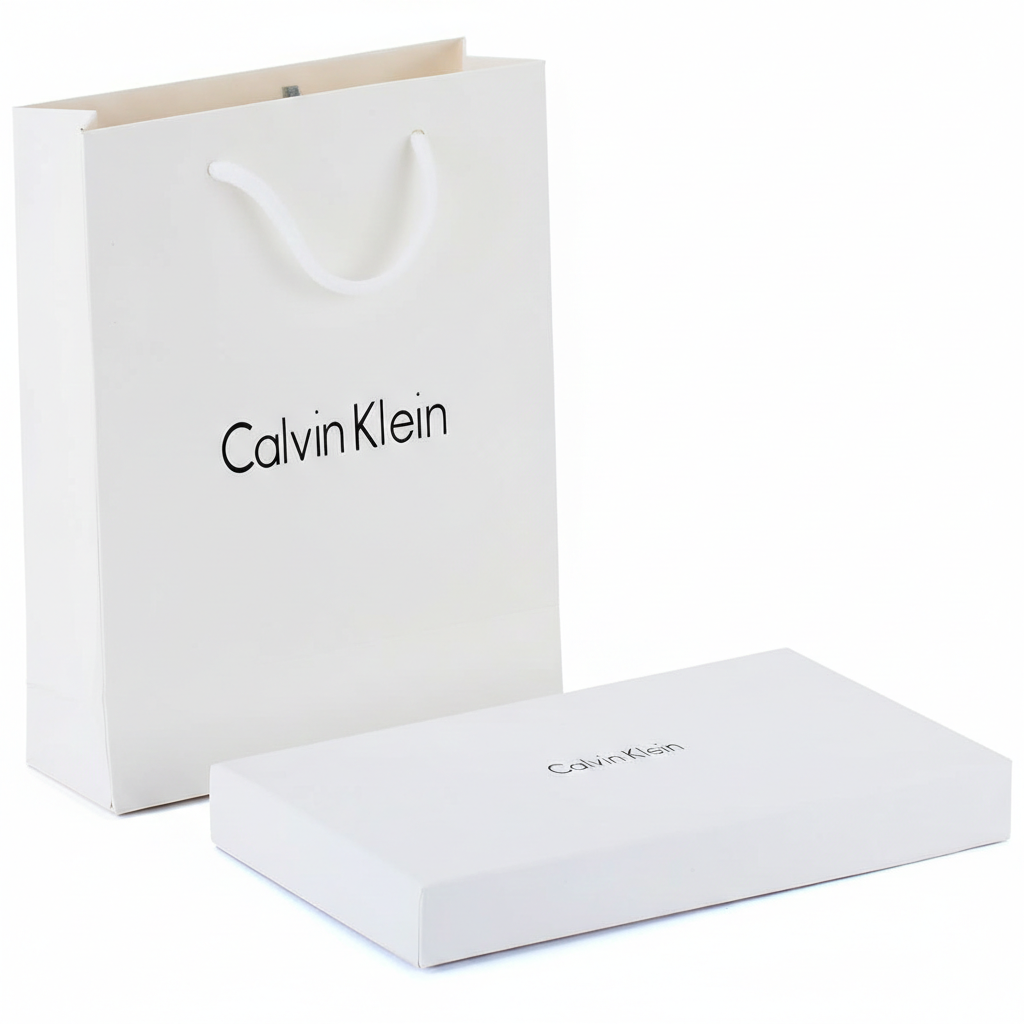 Calvin Klein branded white box and shopping bag on a white background