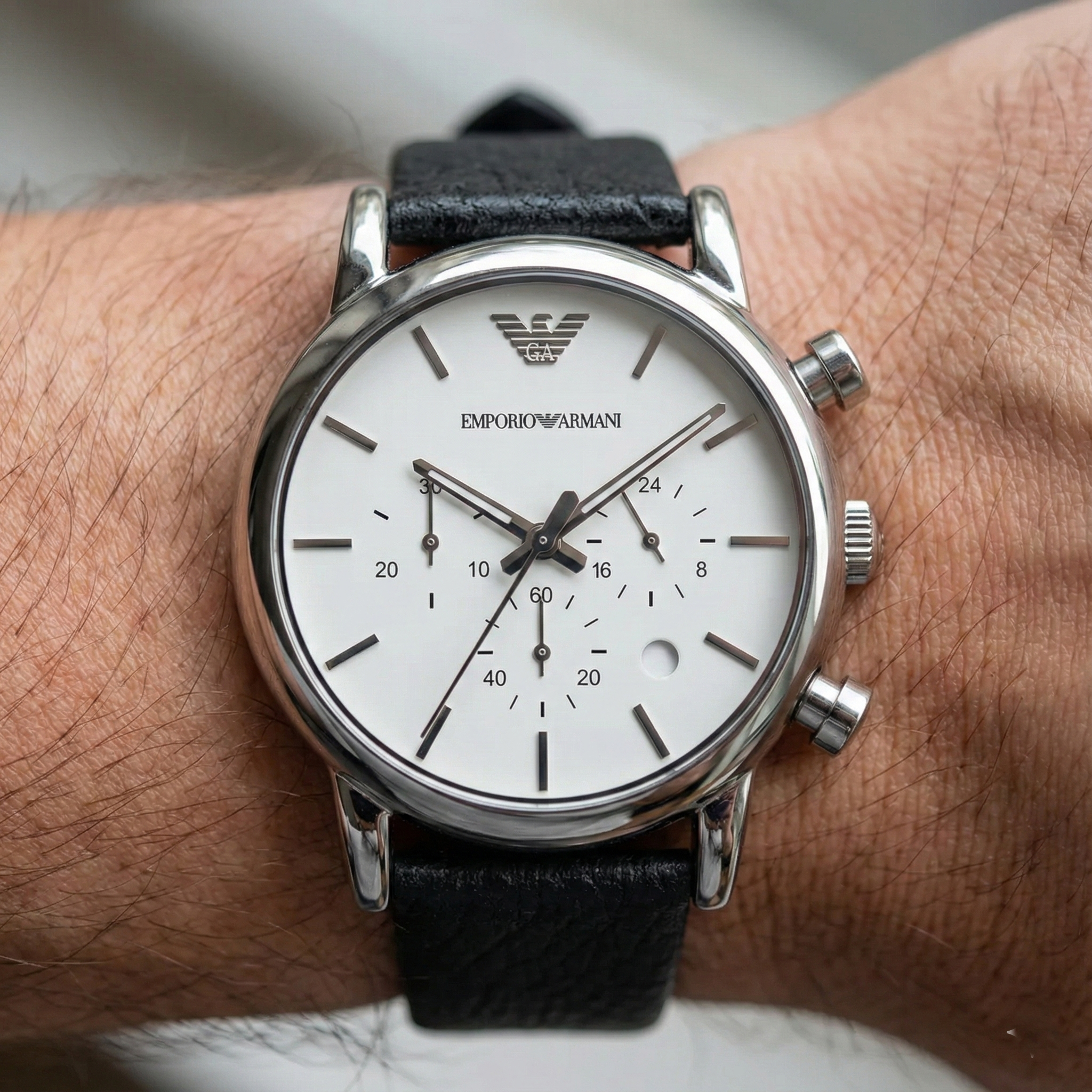 Close up of Armani AR1810 white chronograph dial and silver hands
