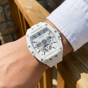 Close up shot of Guess GW0203G2 on wrist highlighting the white skeleton dial and visible gears