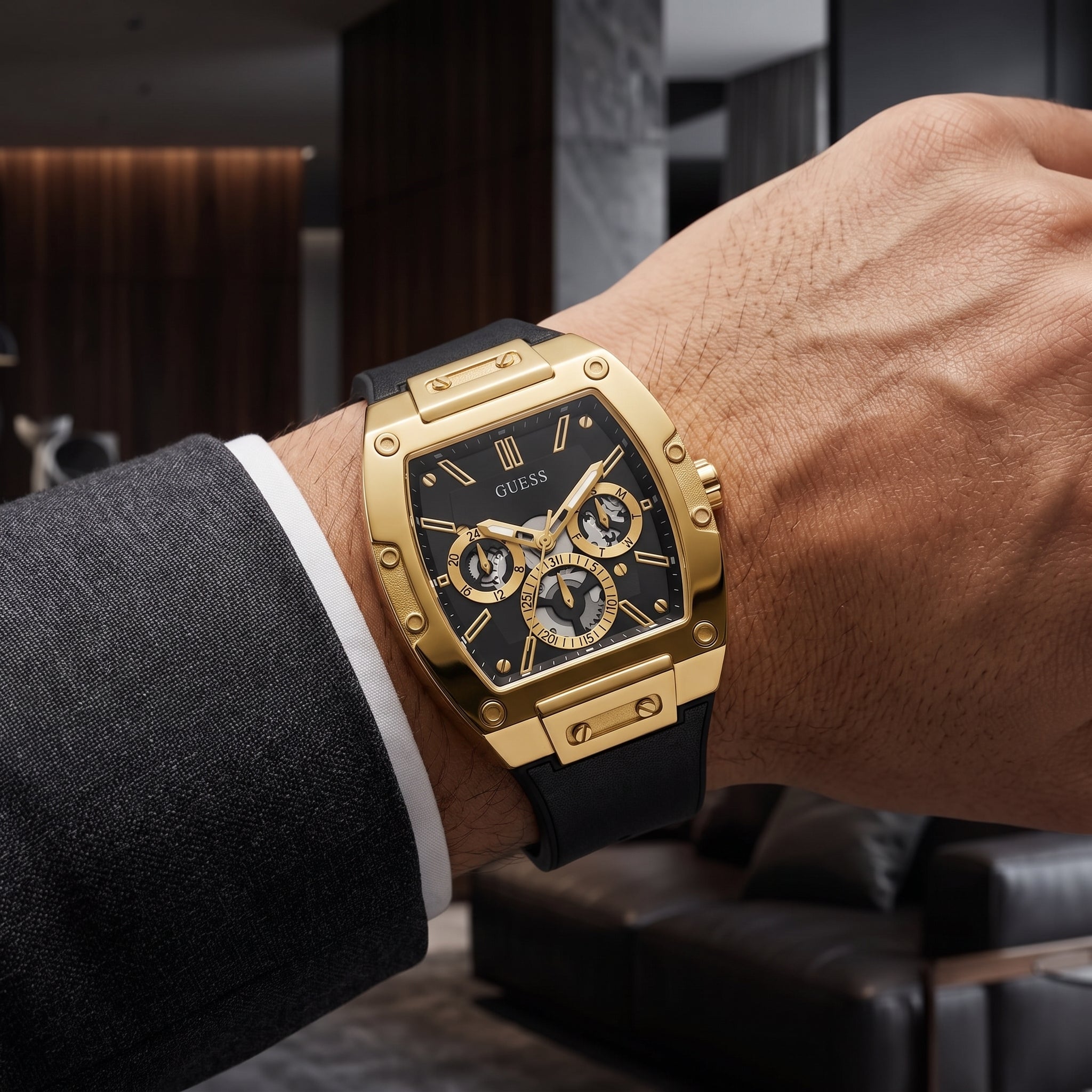 Front view of GUESS Phoenix GW0202G1 men's gold-tone and black multi-function watch