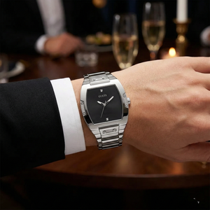 AI lifestyle shot of a man wearing the elegant silver Guess Phoenix diamond watch