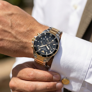 Close-up of AR11680 black dial showing solar technology and gold indices