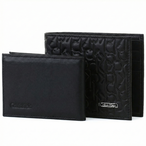 Two black wallets with embossed design on a white background, featuring the Calvin Klein brand.