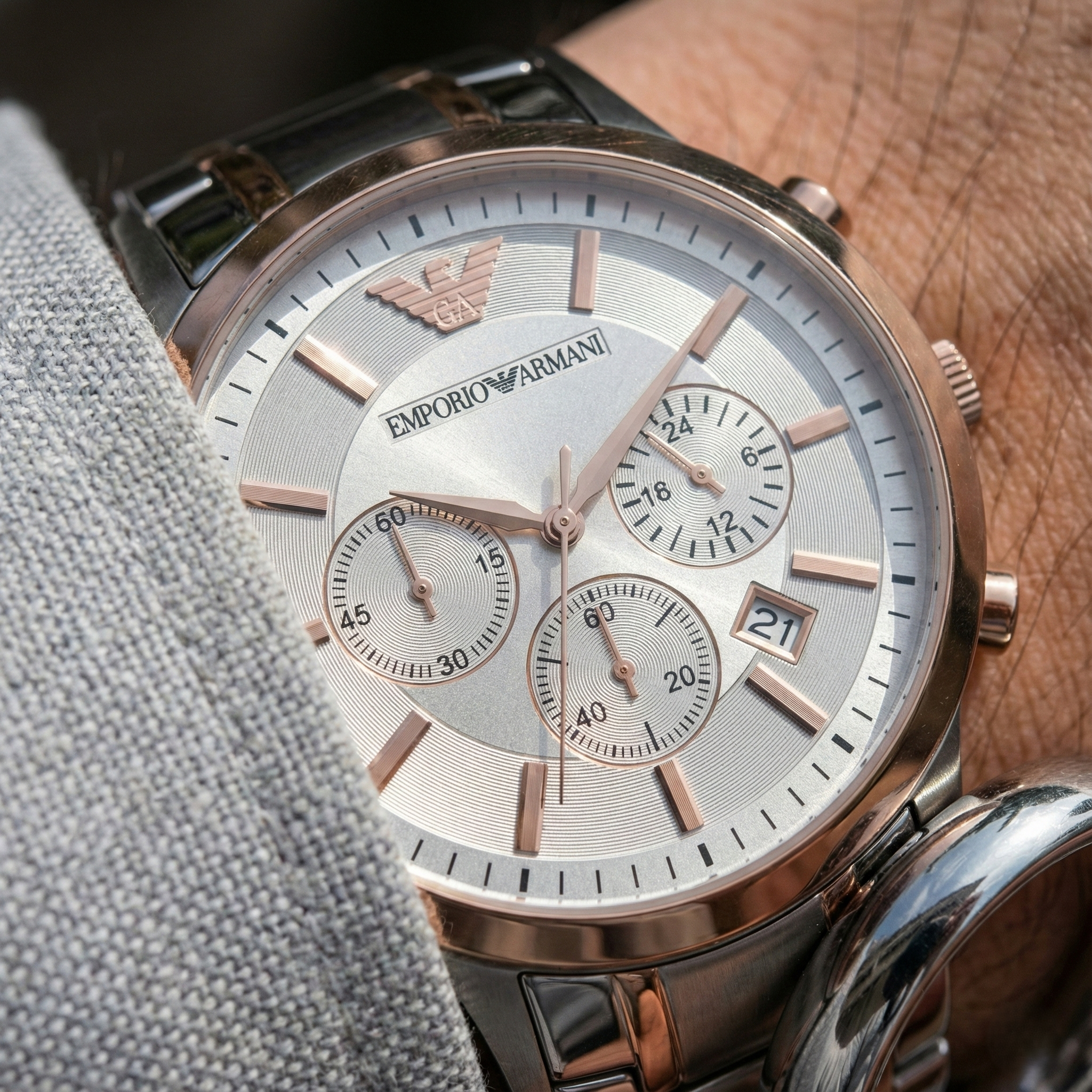 Detailed macro of Armani AR11076 silver dial and rose gold indices