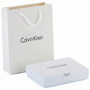 Calvin Klein shopping bag and box on a white background