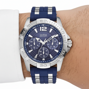 Close up shot of Guess W0366G2 on wrist highlighting the blue dial and silver hands