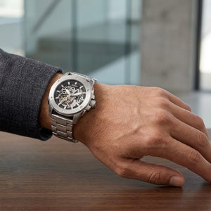 Front view of Fossil Machine ME3081 men's automatic skeleton watch with silver-tone stainless steel bracelet