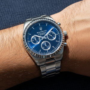 Close up shot of Maserati Competizione R8853100022 watch on wrist showing the blue dial and fluted bezel
