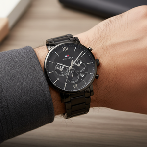 Close up shot of Tommy Hilfiger 1710410 watch on wrist showing the black roman numerals and sub-dials