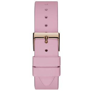 Detailed close-up view of the polished gold-tone buckle clasp on the light pink textured silicone rubber strap for the Guess Solar W1135L2 women's watch