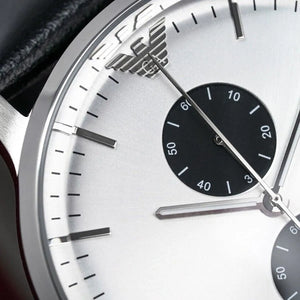 Close-up of Emporio Armani eagle logo and hands on AR0385 watch