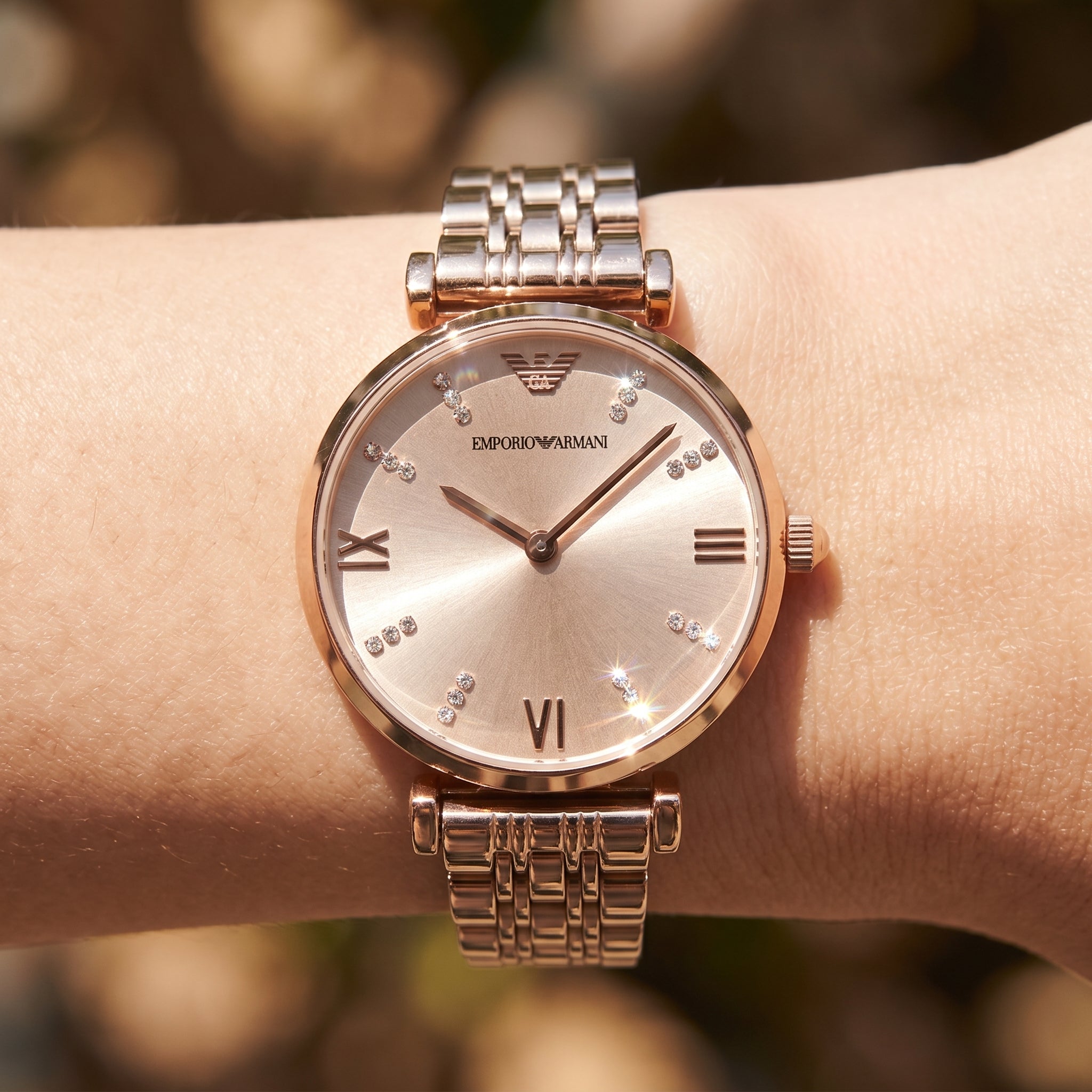 Close up shot of AR11059 highlighting the rose gold dial with crystal markers and roman numerals