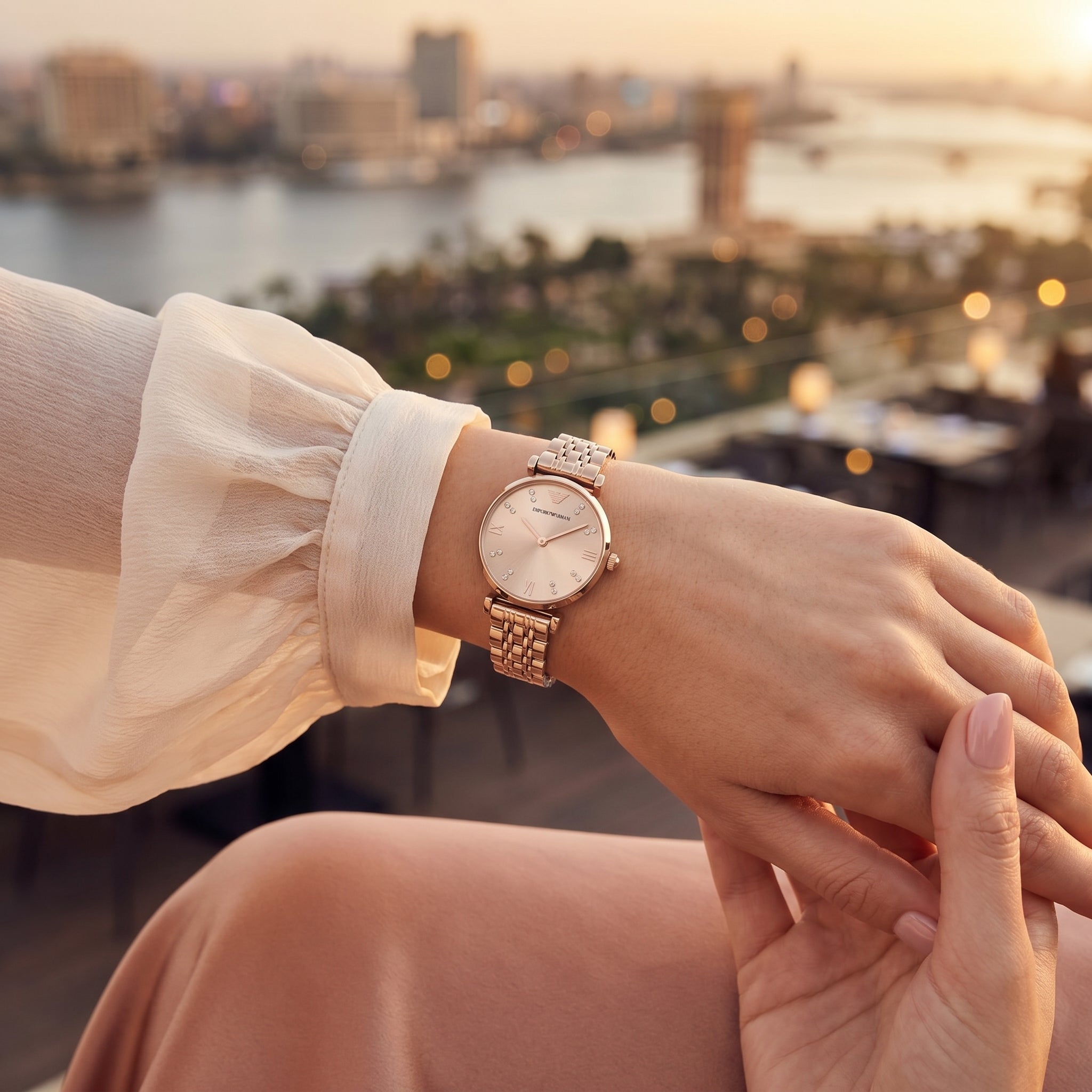 Female model wearing Emporio Armani Gianni T-Bar rose gold watch for a sophisticated luxury look