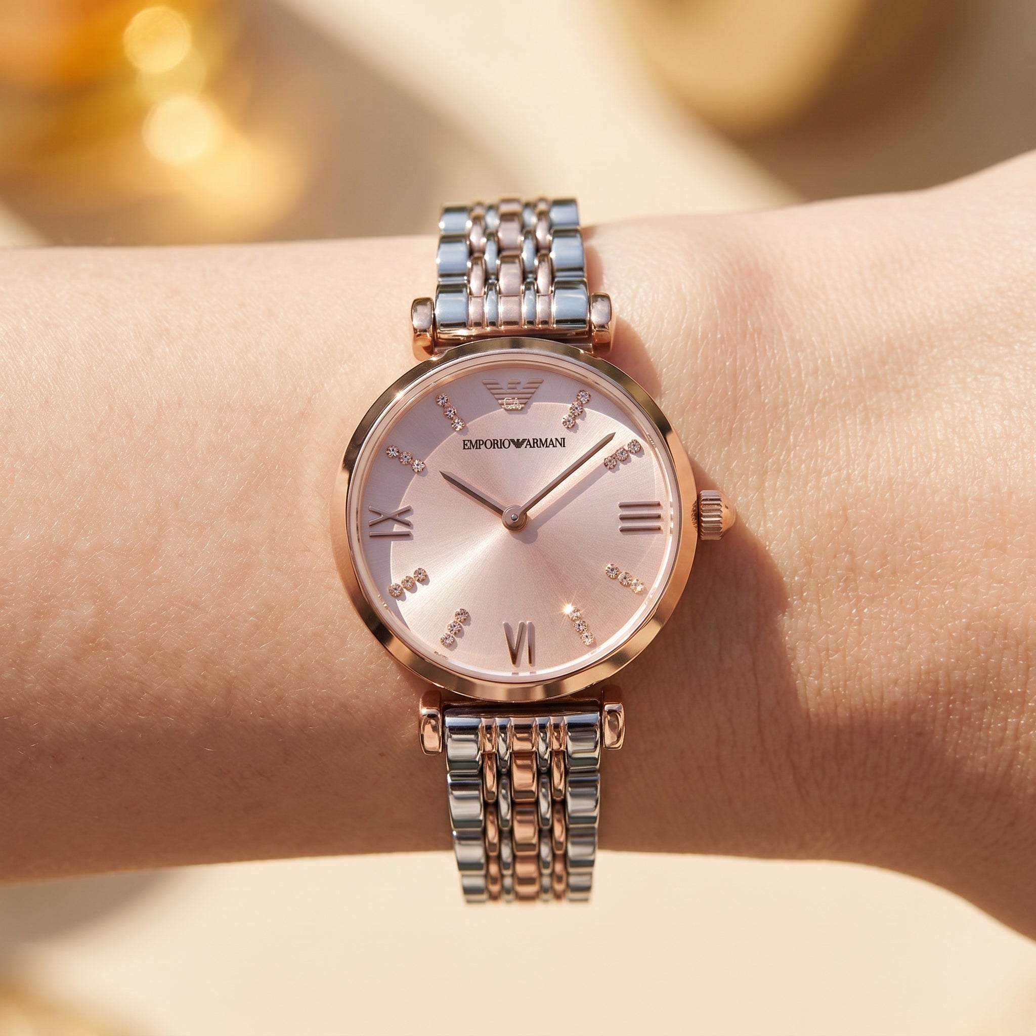 Close up shot of AR11223 highlighting the pink sunray dial with crystal markers and rose gold roman numerals
