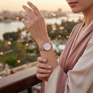 Female model wearing Emporio Armani Gianni T-Bar rose gold crystal watch for a glamorous luxury look