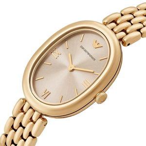 Angled real-life photo of Emporio Armani AR11707 showing the polished gold bezel and sleek dial detail