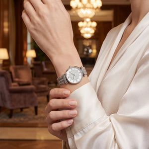 Female model wearing Emporio Armani Gianni T-Bar silver crystal watch for a glamorous luxury look