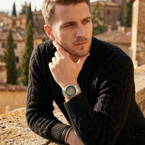 Elegant man wearing Emporio Armani Antonio AR60091 men's automatic watch with silver-tone case and luxury green skeleton dial