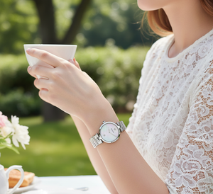 Young woman wearing Emporio Armani AR11235 silver watch with unique wavy bracelet