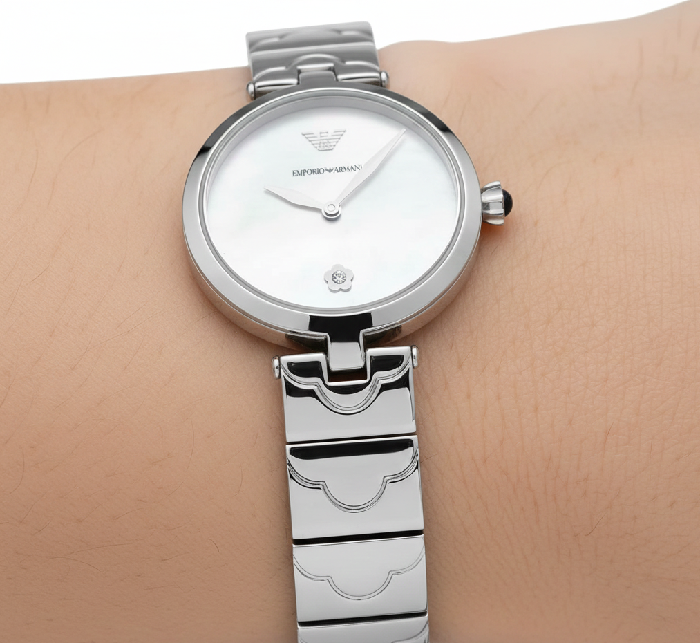 Extreme close-up of Armani AR11235 silver watch showing crystal flower at 6 o'clock