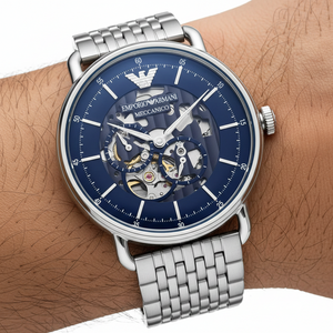 Close up of the AR60024 blue skeleton dial showing the mechanical movement gears and silver eagle logo