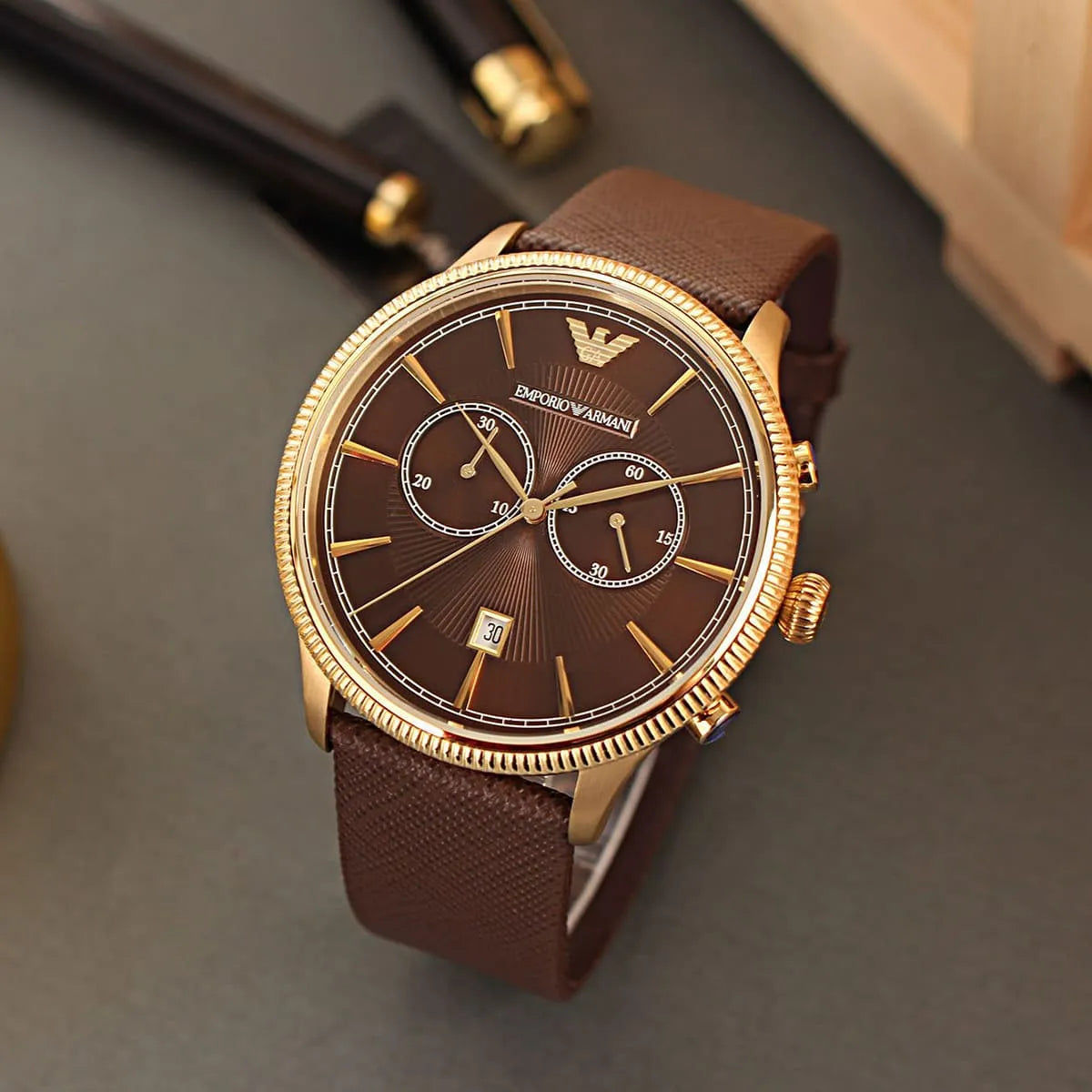 Side view of Emporio Armani AR1793 rose gold case crown and pushers