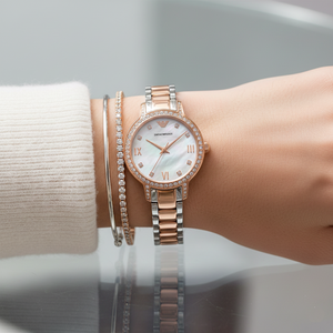 Elegant woman wearing Emporio Armani AR11499 two-tone watch with white silk blouse