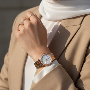 Elegant woman wearing Emporio Armani AR11499 two-tone watch with white silk blouse