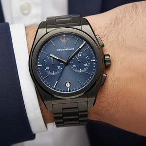 Close up of the AR11561 deep blue sunray dial showing the black eagle logo and chronograph sub-dials