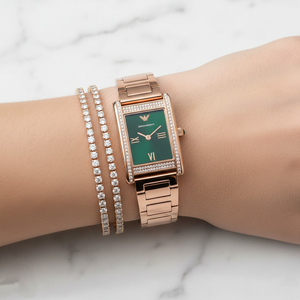 Elegant woman wearing Emporio Armani AR11641 rectangular rose gold watch with green dial