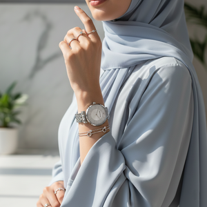 Modest woman wearing Emporio Armani AR11445 sparkling crystal watch with white silk blouse