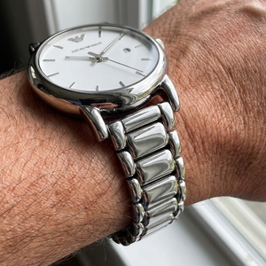Close up of Armani AR1854 showing unique rounded link bracelet and white dial